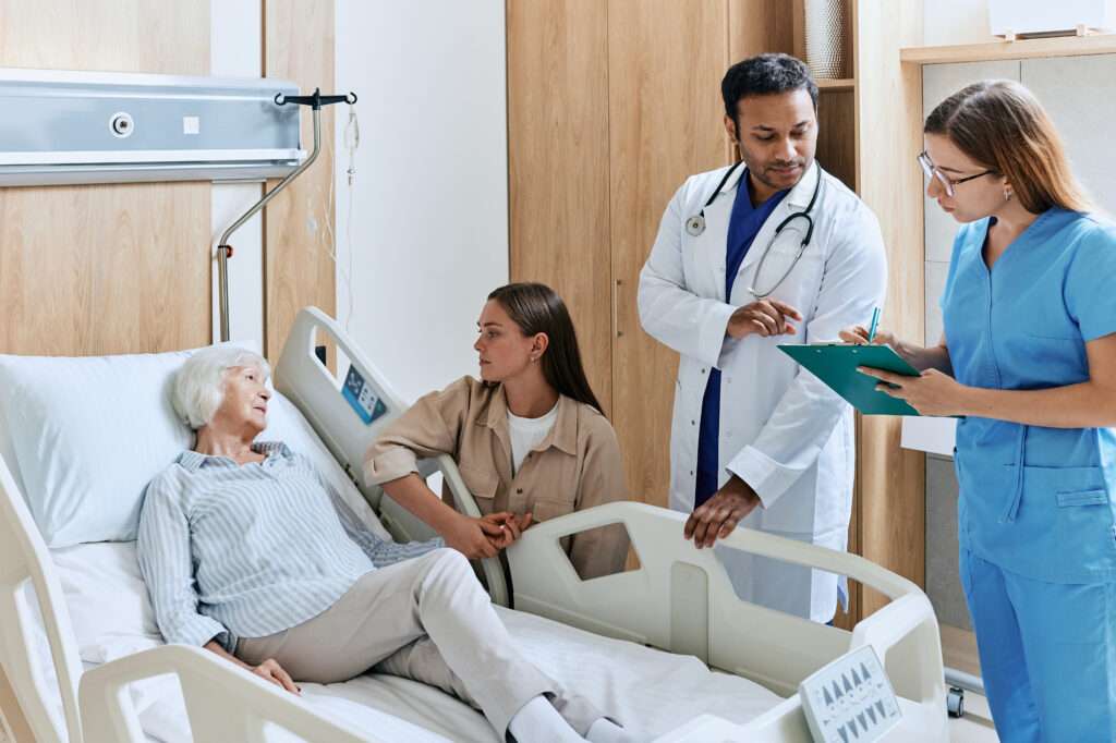 hospital staff around patient's bed