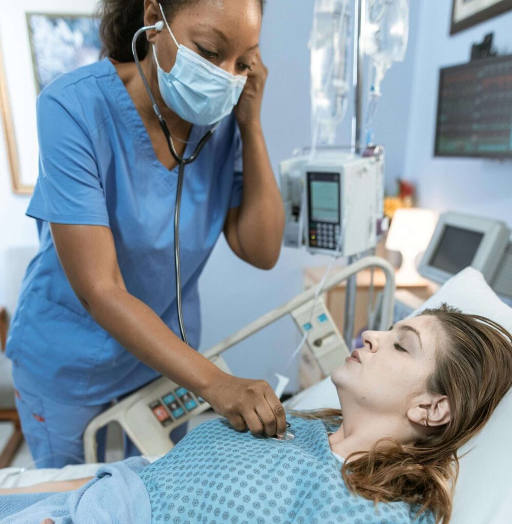 nurse checking patient with stethoscope