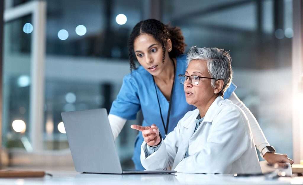 doctor and nurse with laptop