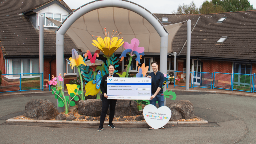 Vivid.Care presenting their donation to Hope House hospice