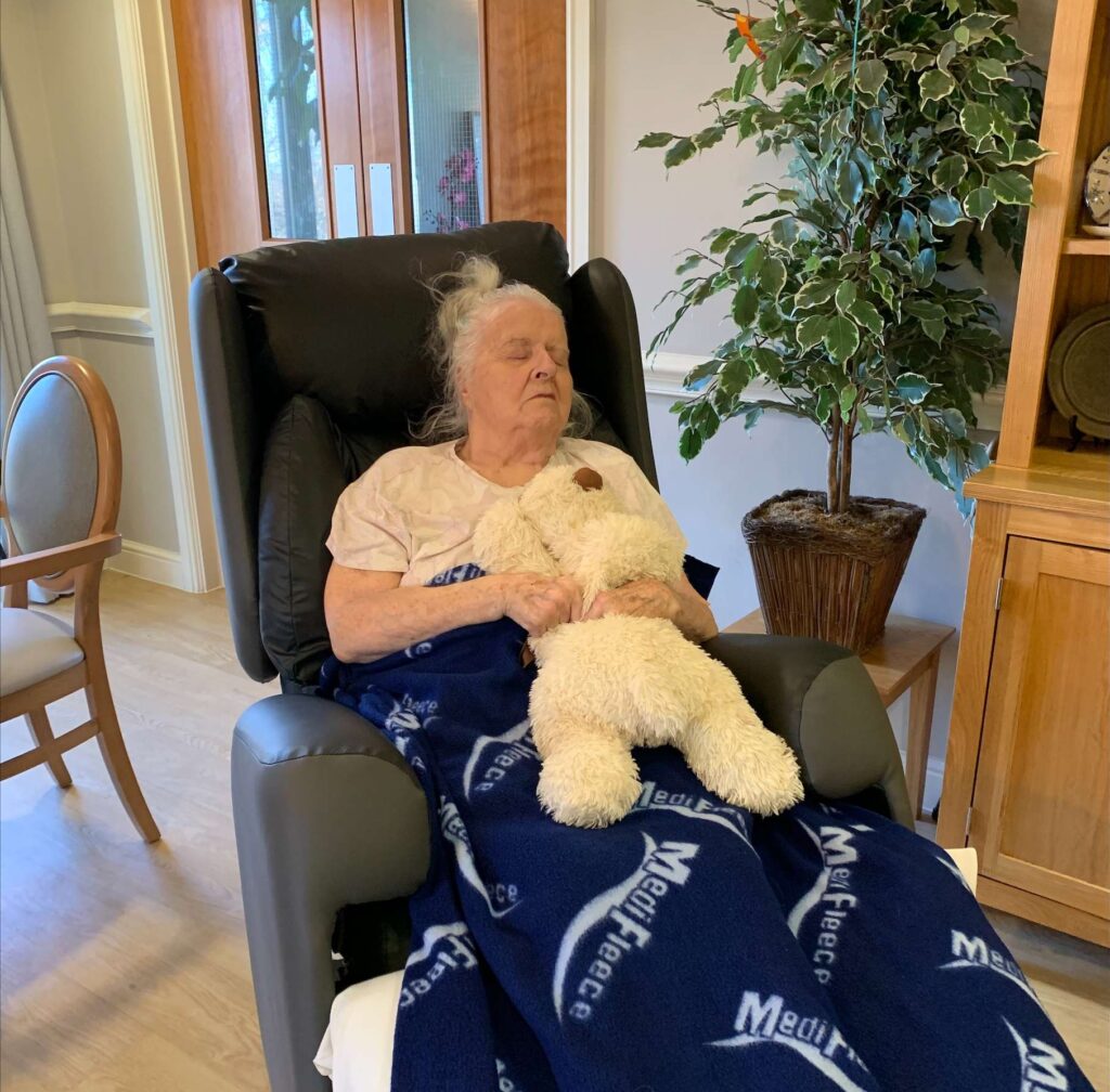 lady asleep in care chair